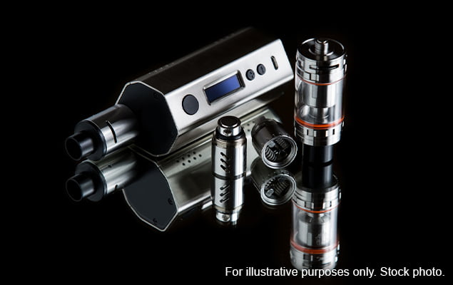 Vape next to tank and components